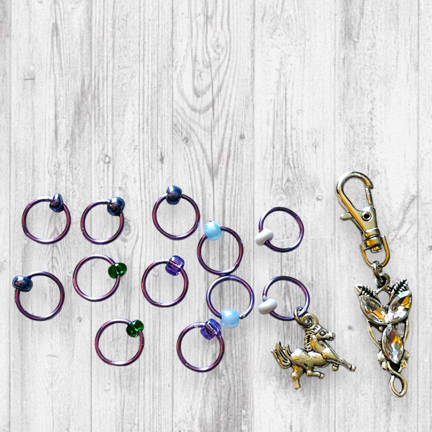 Evenstar inspired Progress and Stitch MarkersAdoreKnitEvenstar inspired Progress and Stitch Markers.   Inspired by the Evenstar worn by Arwen in The Lord of the Rings.  And also inspired by Arwen and Frodo's race on horEvenstar inspired Progress