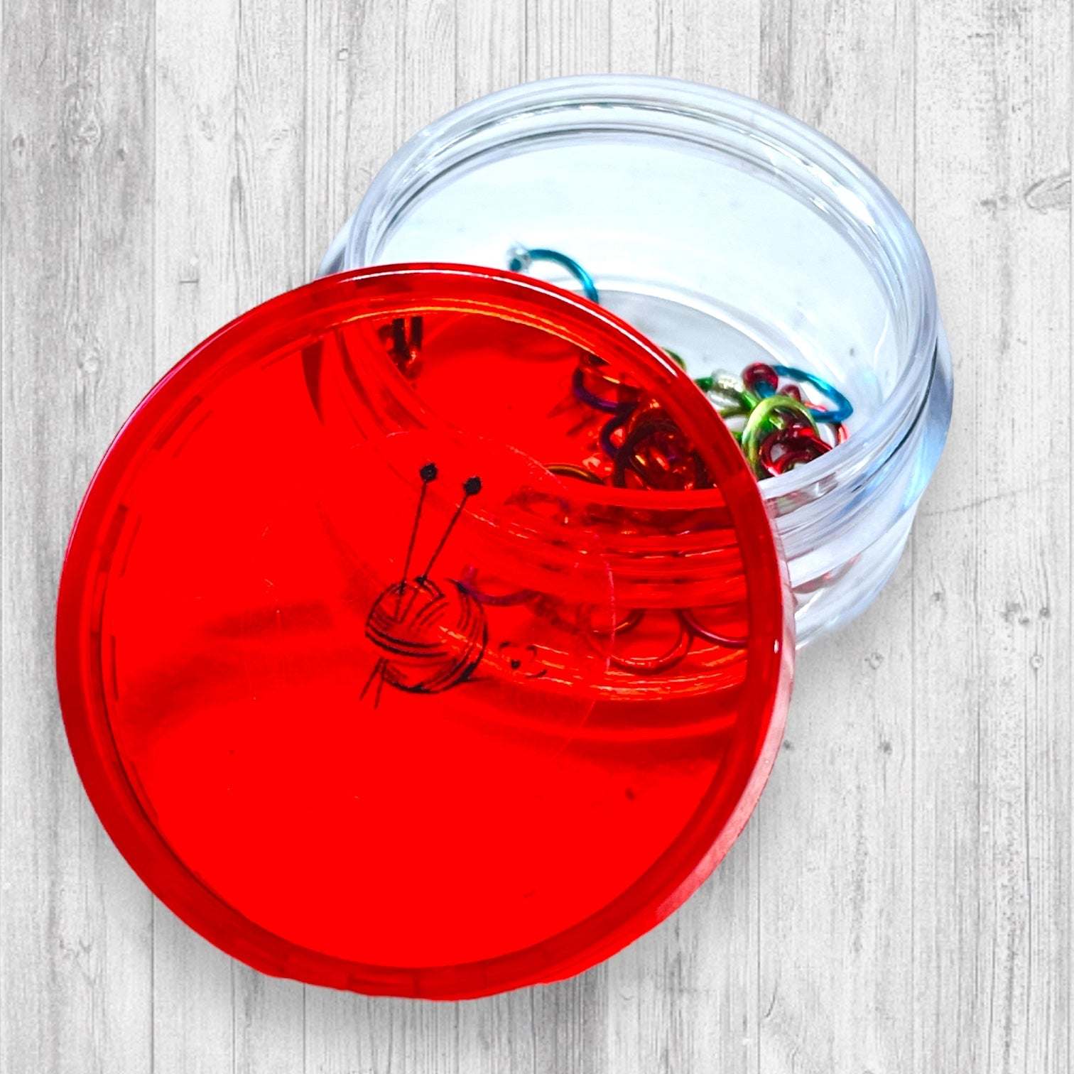 Christmas Sock Knitter's Companion Tiny Stitch Markers with Marker ConAdoreKnitThe Christmas Sock Knitter's Companion!! These tiny stitch markers are perfect for sock knitters. Designed to fit needle sizes: 0-1 US (2-2.5mm). This little set is Companion Tiny Stitch Markers