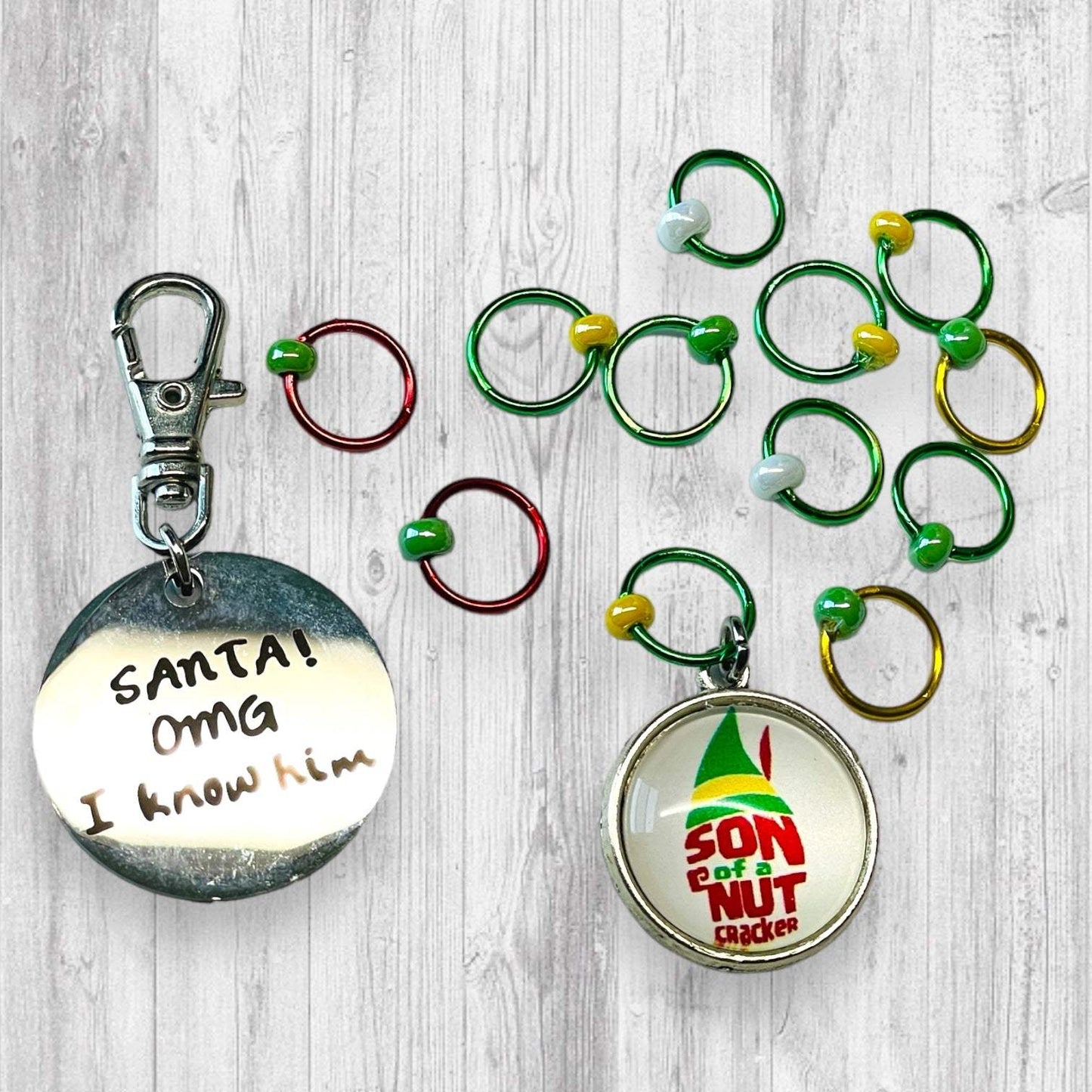 Son of a Nutcracker! Progress and Stitch MarkersAdoreKnit"Son of A Nutcracker" or "Santa OMG I Know Him!” Stitch Markers and Progress Marker. Based on the beloved 2003 movie with Buddy the Elf. Great for your holiday knittStitch Markers