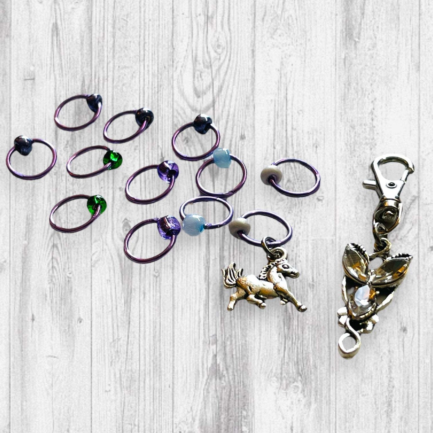 Evenstar inspired Progress and Stitch MarkersAdoreKnitEvenstar inspired Progress and Stitch Markers.   Inspired by the Evenstar worn by Arwen in The Lord of the Rings.  And also inspired by Arwen and Frodo's race on horEvenstar inspired Progress