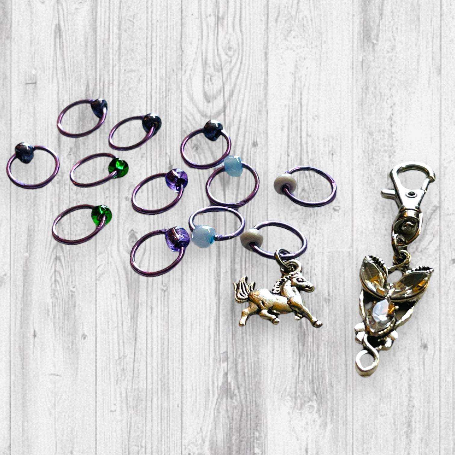 Evenstar inspired Progress and Stitch MarkersAdoreKnitEvenstar inspired Progress and Stitch Markers.   Inspired by the Evenstar worn by Arwen in The Lord of the Rings.  And also inspired by Arwen and Frodo's race on horEvenstar inspired Progress