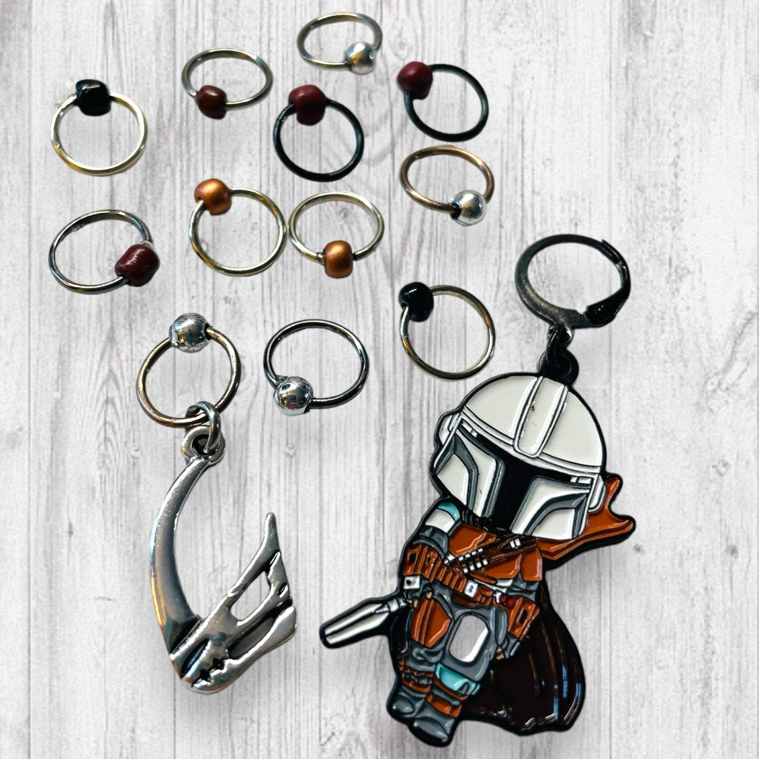 Next Generation Bounty Hunter Progress and Stitch MarkersAdoreKnitNext Generation Bounty Hunter Progress and Stitch Markers. Inspired by The Mandalorian, Din Djarin from the Mandalorian Series.  The prefect gift for a knitter! ThesGeneration Bounty Hunter Progress