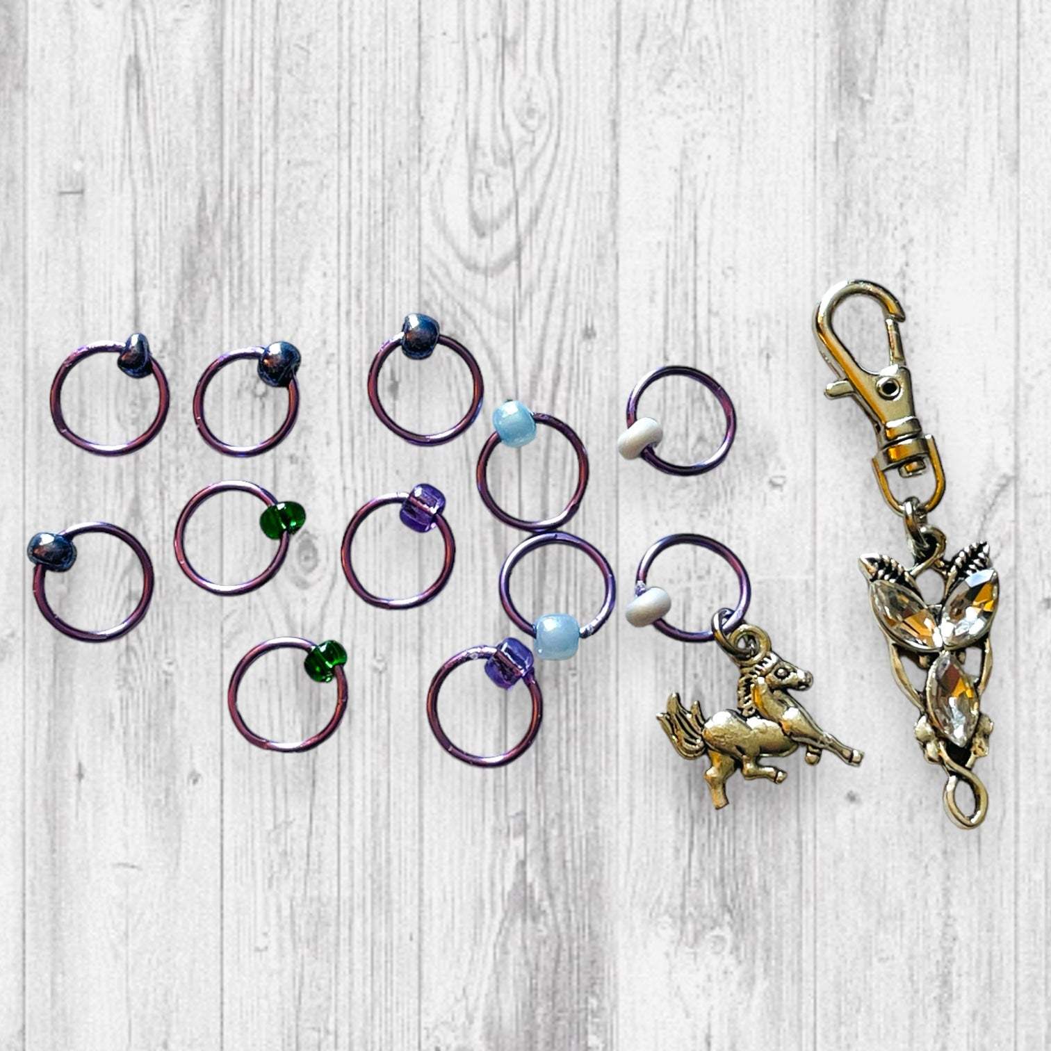 Evenstar inspired Progress and Stitch MarkersAdoreKnitEvenstar inspired Progress and Stitch Markers.   Inspired by the Evenstar worn by Arwen in The Lord of the Rings.  And also inspired by Arwen and Frodo's race on horEvenstar inspired Progress