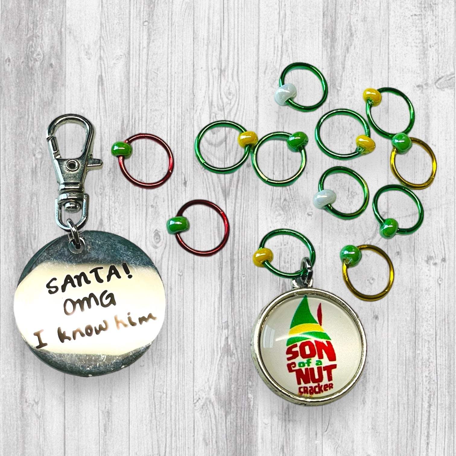 Son of a Nutcracker! Progress and Stitch MarkersAdoreKnit"Son of A Nutcracker" or "Santa OMG I Know Him!” Stitch Markers and Progress Marker. Based on the beloved 2003 movie with Buddy the Elf. Great for your holiday knittStitch Markers