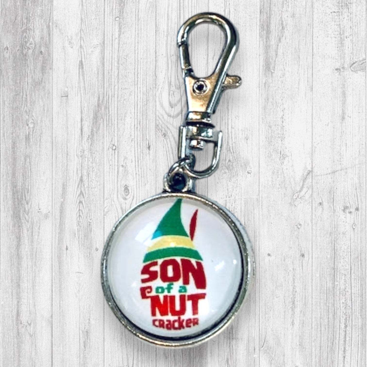 Son of a Nutcracker! Progress and Stitch MarkersAdoreKnit"Son of A Nutcracker" or "Santa OMG I Know Him!” Stitch Markers and Progress Marker. Based on the beloved 2003 movie with Buddy the Elf. Great for your holiday knittStitch Markers