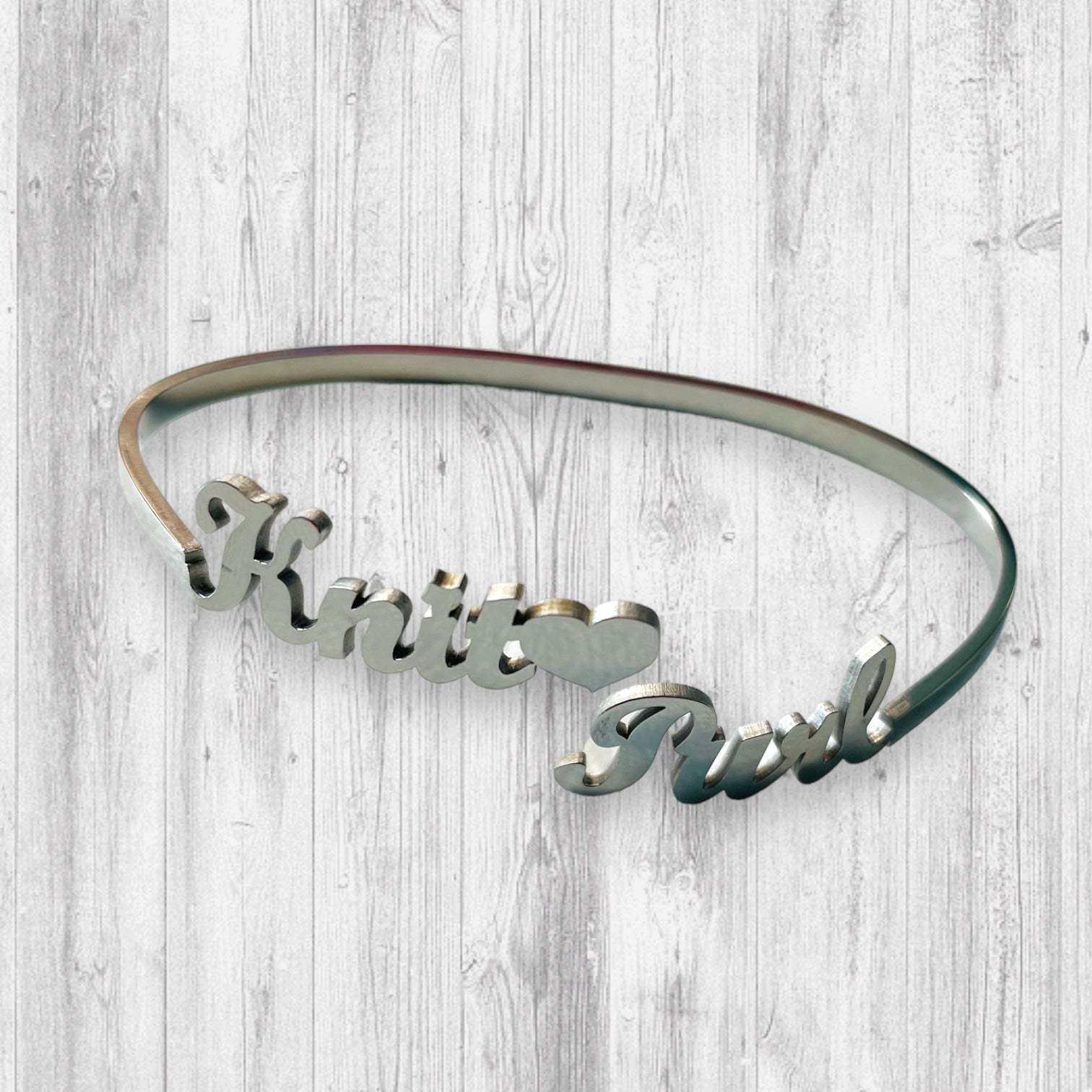 Knit🖤 Purl Bracelet tooAdoreKnitThe Knit 🖤 Purl Bracelet designed by Steph, this stainless steel bangle is the perfect way to show your love of knitting.  Measuring 6.25" in circumference the bangKnit🖤 Purl Bracelet