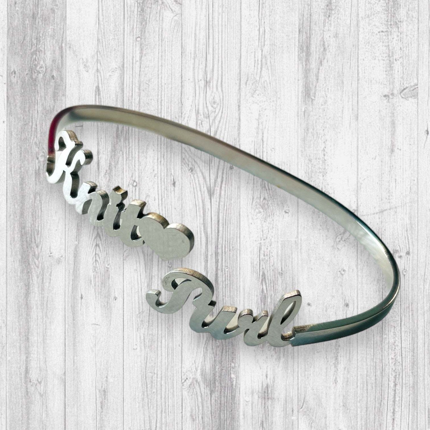 Knit🖤 Purl Bracelet tooAdoreKnitThe Knit 🖤 Purl Bracelet designed by Steph, this stainless steel bangle is the perfect way to show your love of knitting.  Measuring 6.25" in circumference the bangKnit🖤 Purl Bracelet