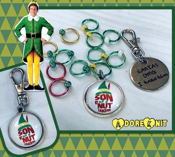 Son of a Nutcracker! Progress and Stitch MarkersAdoreKnit"Son of A Nutcracker" or "Santa OMG I Know Him!” Stitch Markers and Progress Marker. Based on the beloved 2003 movie with Buddy the Elf. Great for your holiday knittStitch Markers