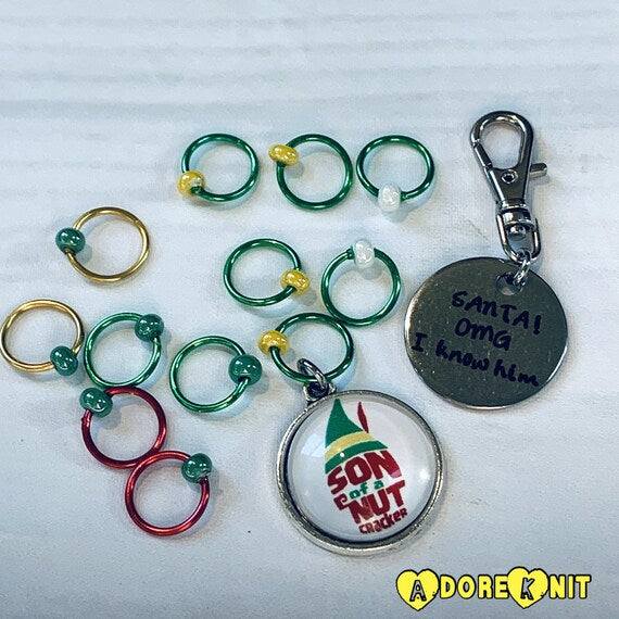 Son of a Nutcracker! Progress and Stitch MarkersAdoreKnit"Son of A Nutcracker" or "Santa OMG I Know Him!” Stitch Markers and Progress Marker. Based on the beloved 2003 movie with Buddy the Elf. Great for your holiday knittStitch Markers