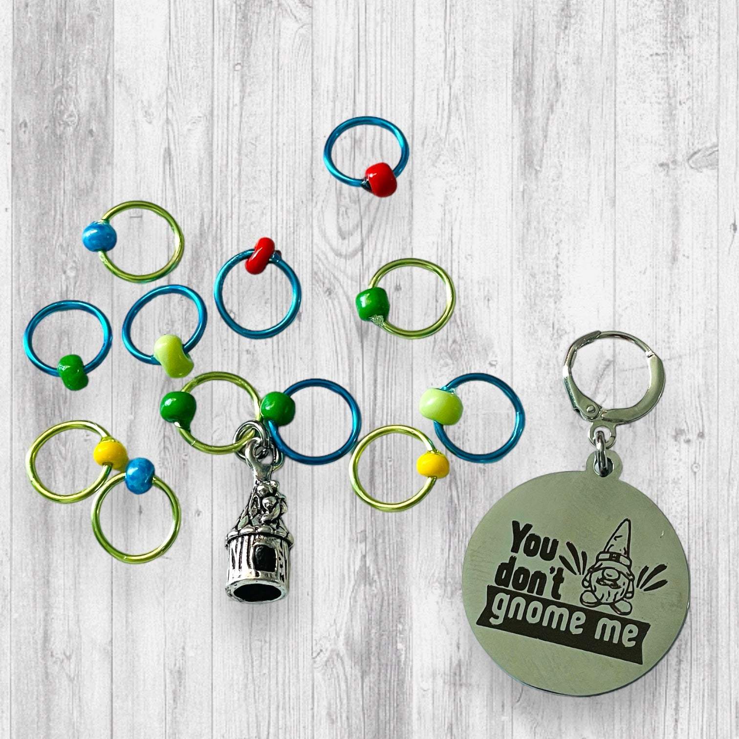 You Don't Gnome Me Progress and Stitch MarkersAdoreKnitYou Don't Gnome Me Progress and Stitch Markers. We couldn't decide if the Gnome house or the daisy went better for this set, so you decide!  Both match perfectly witStitch Markers