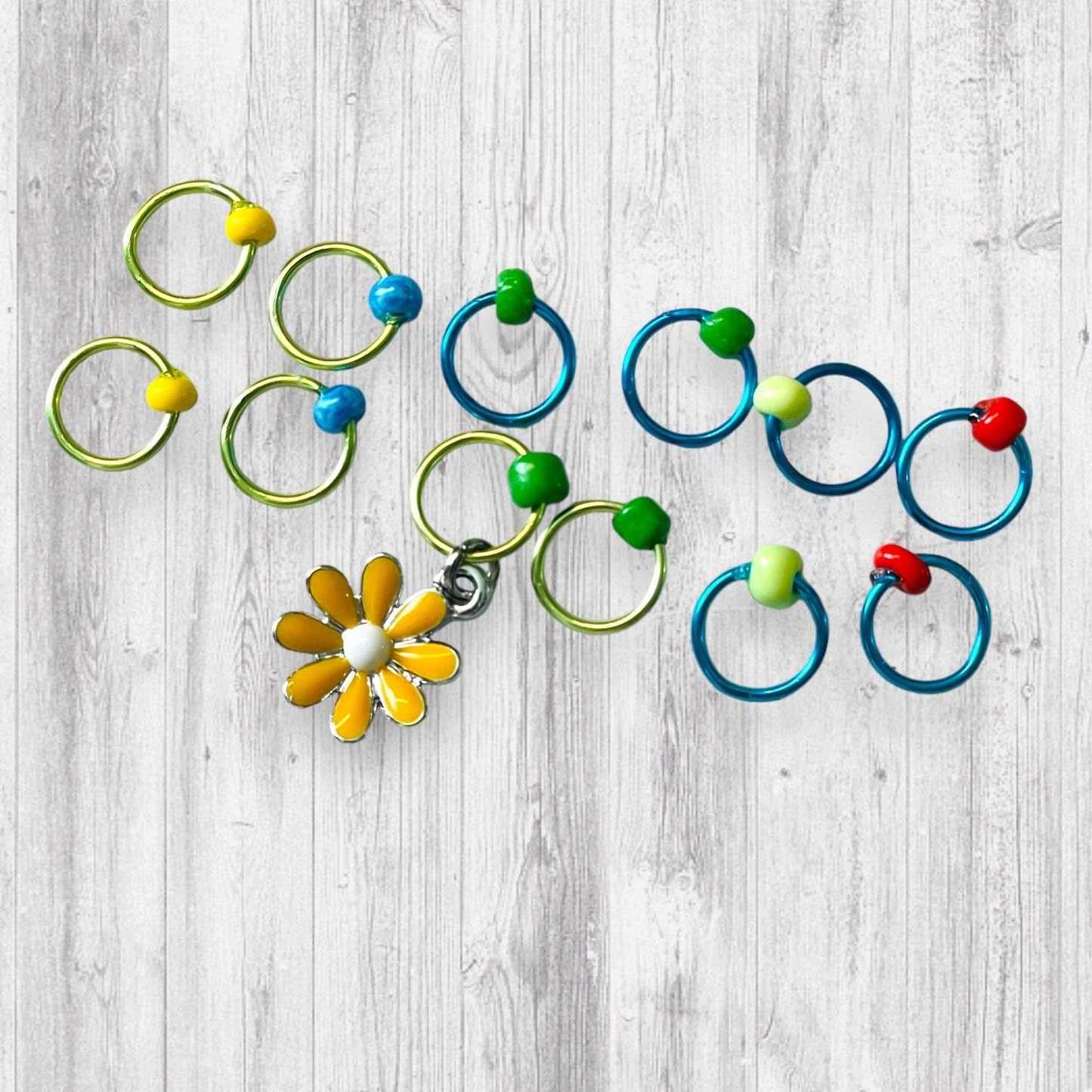 You Don't Gnome Me Progress and Stitch MarkersAdoreKnitYou Don't Gnome Me Progress and Stitch Markers. We couldn't decide if the Gnome house or the daisy went better for this set, so you decide!  Both match perfectly witStitch Markers