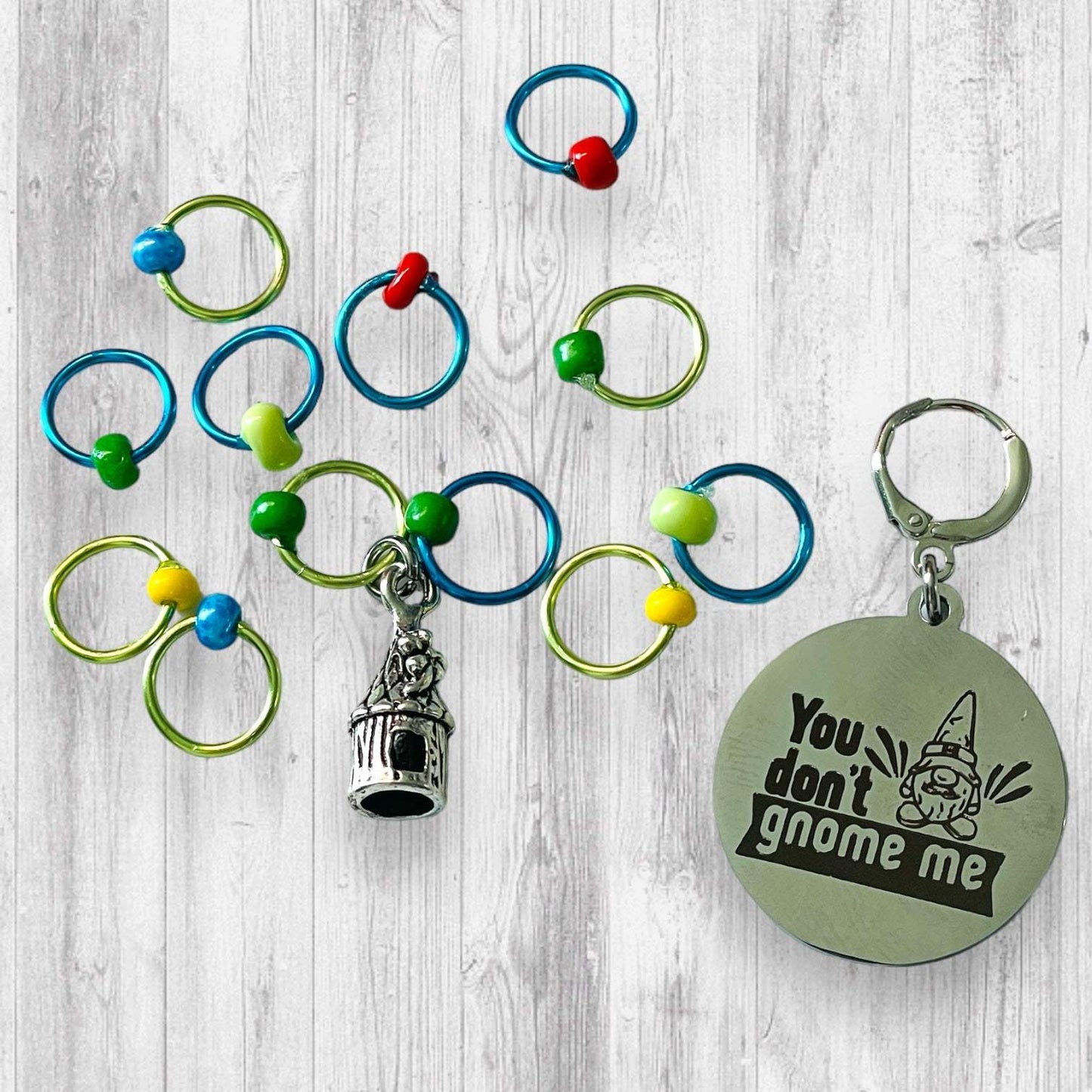 You Don't Gnome Me Progress and Stitch MarkersAdoreKnitYou Don't Gnome Me Progress and Stitch Markers. We couldn't decide if the Gnome house or the daisy went better for this set, so you decide!  Both match perfectly witStitch Markers