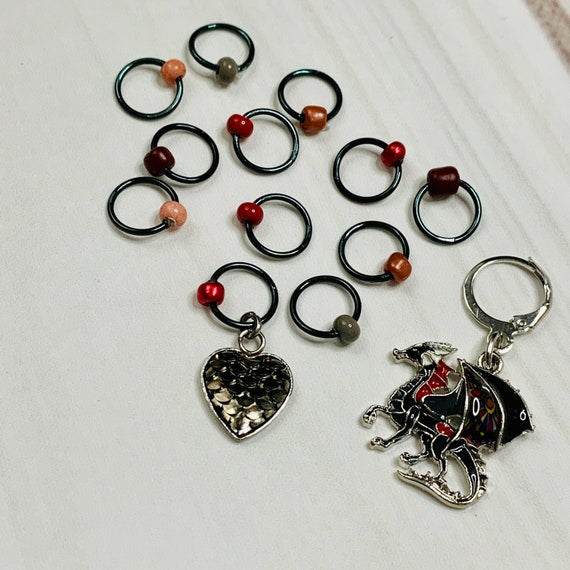 Fire Will Reign Progress and Stitch MarkersAdoreKnit“It has been said that dragon-fire could melt and consume the Rings of Power, but there is not now any dragon left on earth in which the old fire is hot enough; nor Reign Progress