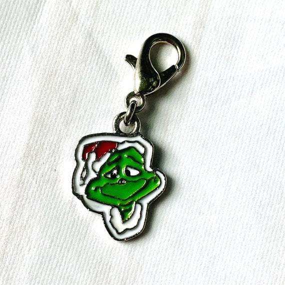 The Grinch Inspired Progress and Stitch MarkersAdoreKnitThe Grinch Progress and Stitch Markers. Inspired by the 1966 classic animated movie.  The prefect gift for a knitter! These stitch markers are great for a knitter orGrinch Inspired Progress