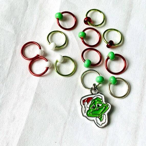 The Grinch Inspired Progress and Stitch MarkersAdoreKnitThe Grinch Progress and Stitch Markers. Inspired by the 1966 classic animated movie.  The prefect gift for a knitter! These stitch markers are great for a knitter orGrinch Inspired Progress