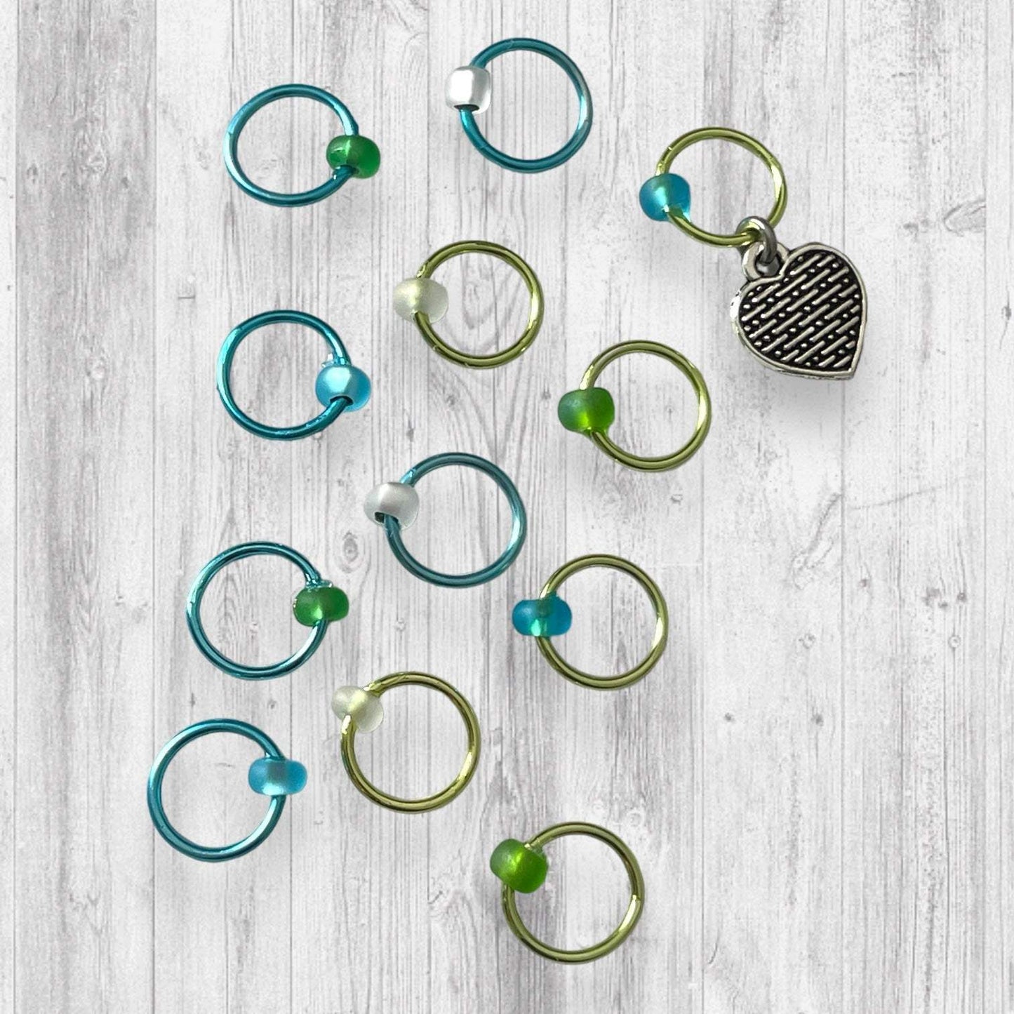 Love Some Knitting & Coffee Progress and Stitch MarkersAdoreKnitLove Some Knitting & Coffee Progress Marker and Stitch Markers.  Who doesn't love a nice warm beverage, their knitting and a new episode of your favorite show?  Knitting & Coffee Progress