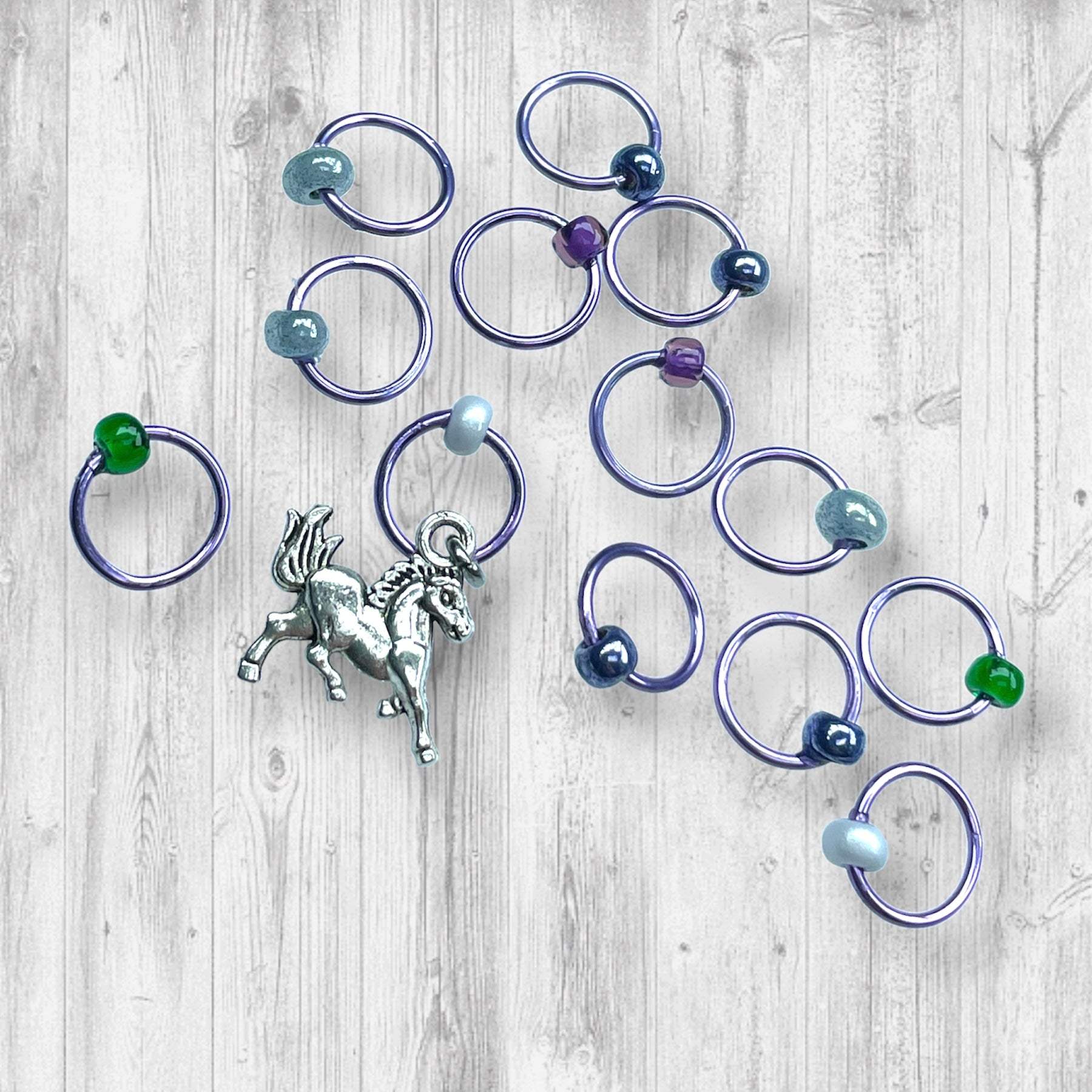 Evenstar inspired Progress and Stitch MarkersAdoreKnitEvenstar inspired Progress and Stitch Markers.   Inspired by the Evenstar worn by Arwen in The Lord of the Rings.  And also inspired by Arwen and Frodo's race on horEvenstar inspired Progress