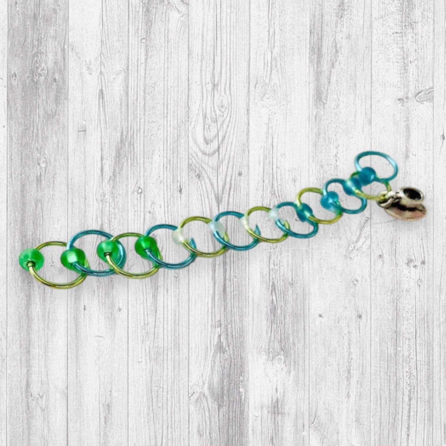 Love Some Knitting & Coffee Progress and Stitch MarkersAdoreKnitLove Some Knitting & Coffee Progress Marker and Stitch Markers.  Who doesn't love a nice warm beverage, their knitting and a new episode of your favorite show?  Knitting & Coffee Progress