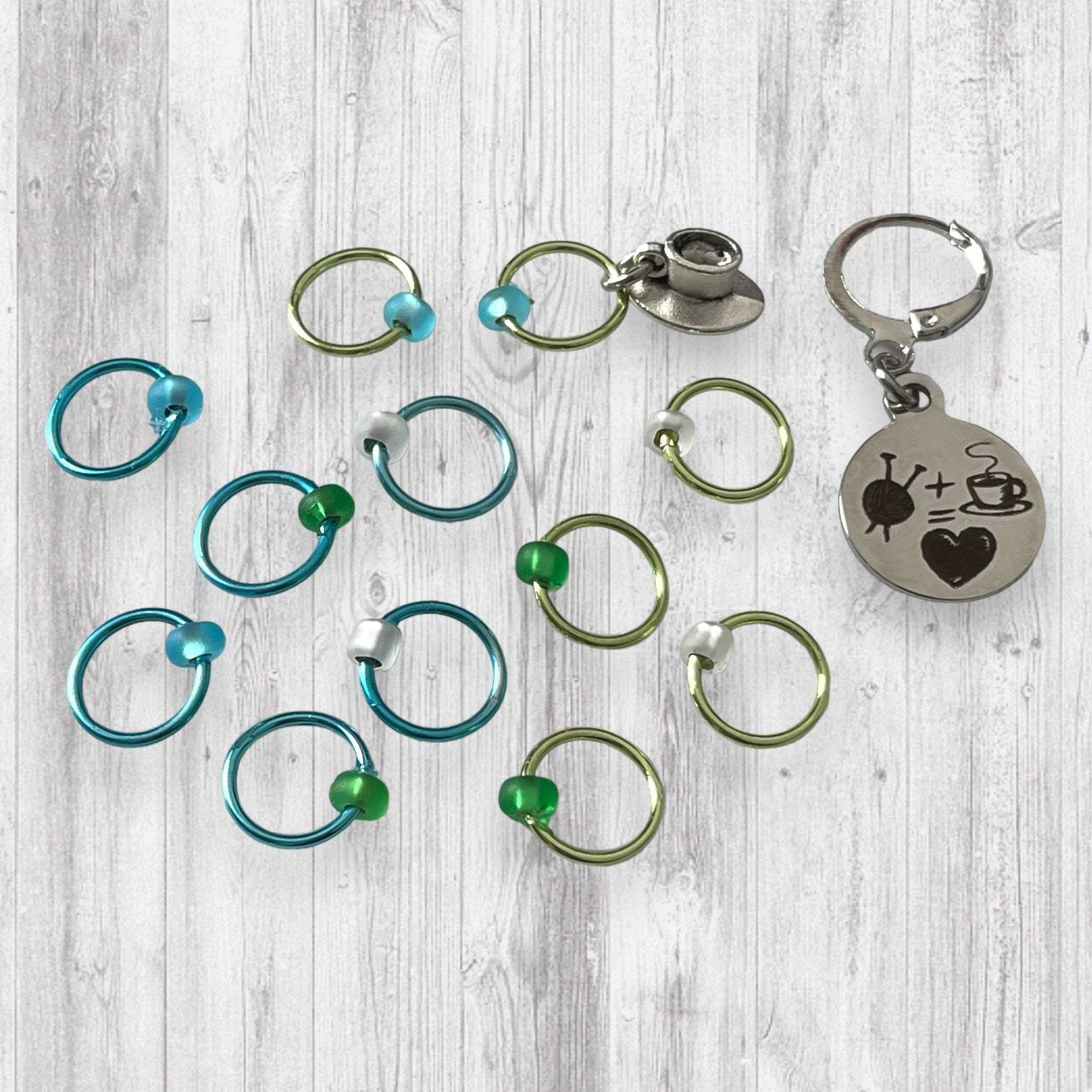 Love Some Knitting & Coffee Progress and Stitch MarkersAdoreKnitLove Some Knitting & Coffee Progress Marker and Stitch Markers.  Who doesn't love a nice warm beverage, their knitting and a new episode of your favorite show?  Knitting & Coffee Progress