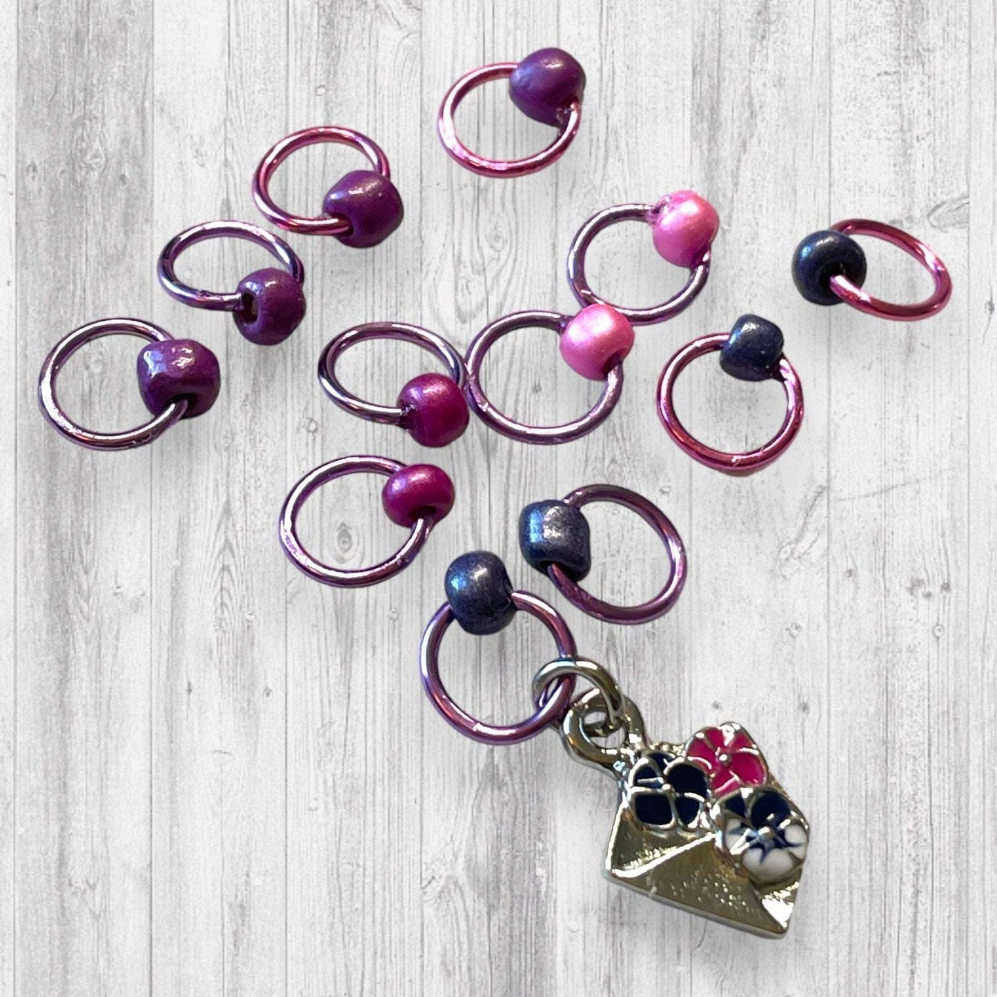 Gnome Place like Home Purple Pansies Progress and Stitch MarkersAdoreKnitAdoreKnit EXCLUSIVE! Gnome Place like Home with Purple Pansies Progress and Stitch Markers. For the longest time I didn't know what girl Gnomes looked like.  This laHome Purple Pansies Progress