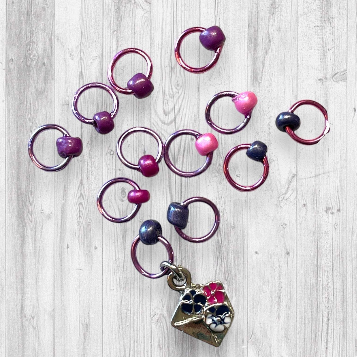 Gnome Place like Home Purple Pansies Progress and Stitch MarkersAdoreKnitAdoreKnit EXCLUSIVE! Gnome Place like Home with Purple Pansies Progress and Stitch Markers. For the longest time I didn't know what girl Gnomes looked like.  This laHome Purple Pansies Progress