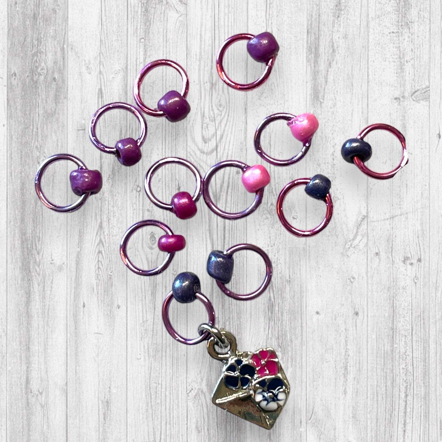 Gnome Place like Home Purple Pansies Progress and Stitch MarkersAdoreKnitAdoreKnit EXCLUSIVE! Gnome Place like Home with Purple Pansies Progress and Stitch Markers. For the longest time I didn't know what girl Gnomes looked like.  This laHome Purple Pansies Progress