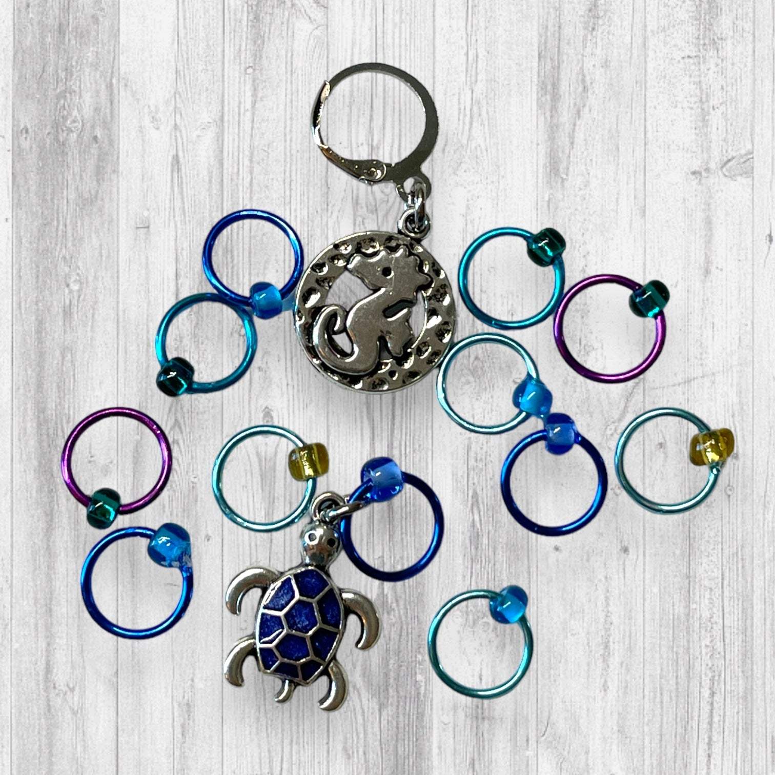 Seahorse and Blue Turtle Progress and Stitch MarkersAdoreKnitSeahorse and Blue Turtle Progress and Stitch Markers. The prefect gift for a knitter! These stitch markers are great for a knitter or crocheter. Include in a swap paBlue Turtle Progress