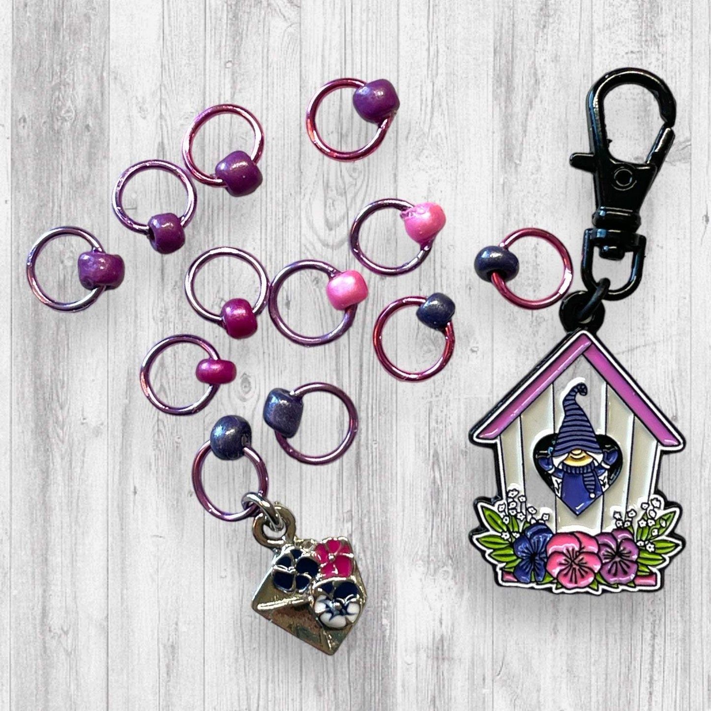 Gnome Place like Home Purple Pansies Progress and Stitch MarkersAdoreKnitAdoreKnit EXCLUSIVE! Gnome Place like Home with Purple Pansies Progress and Stitch Markers. For the longest time I didn't know what girl Gnomes looked like.  This laHome Purple Pansies Progress