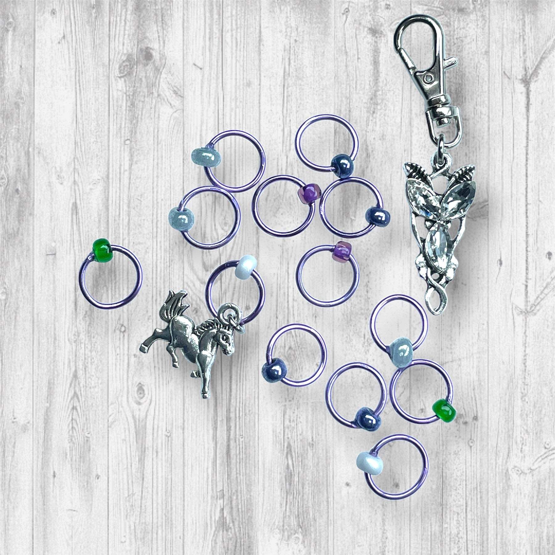 Evenstar inspired Progress and Stitch MarkersAdoreKnitEvenstar inspired Progress and Stitch Markers.   Inspired by the Evenstar worn by Arwen in The Lord of the Rings.  And also inspired by Arwen and Frodo's race on horEvenstar inspired Progress