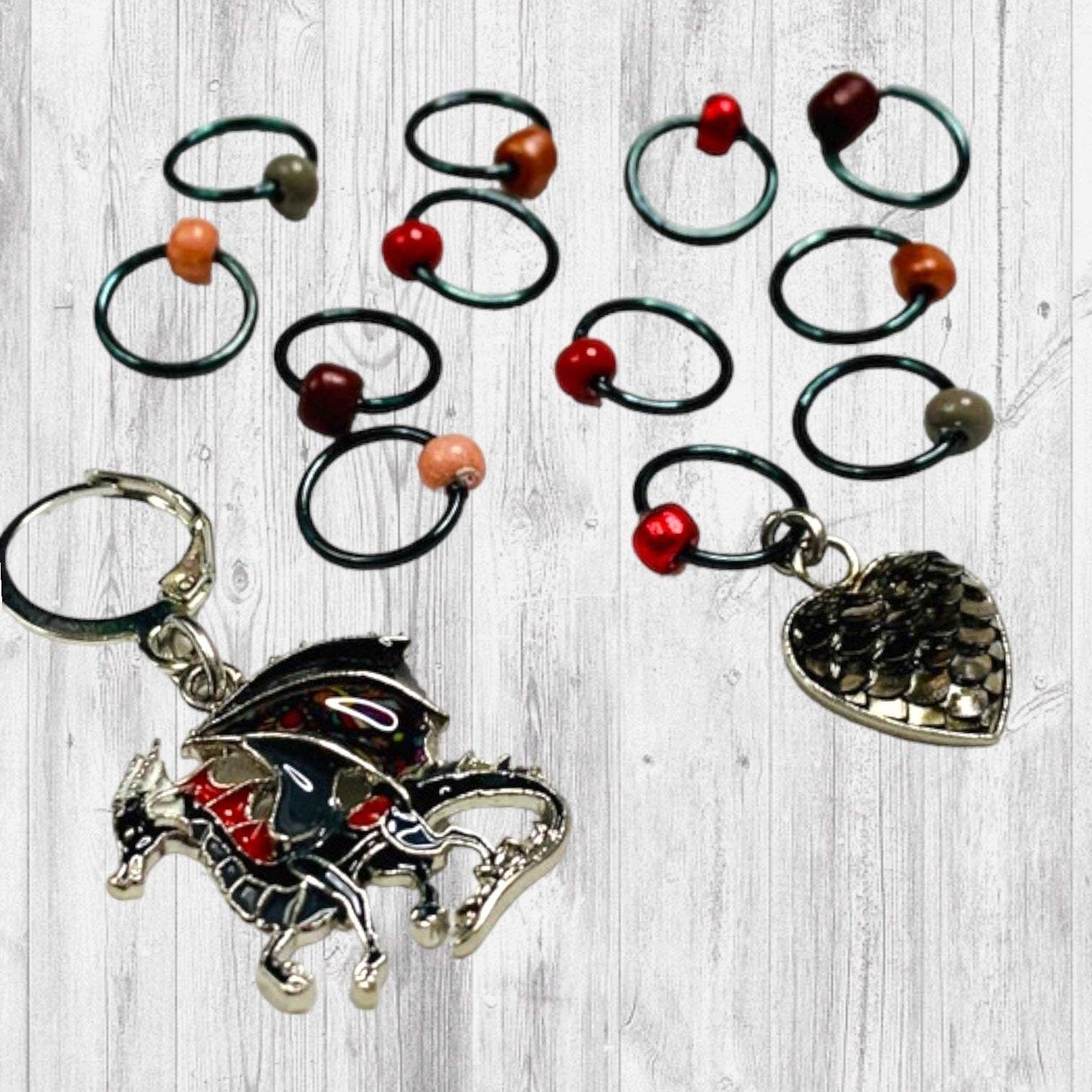 Fire Will Reign Progress and Stitch MarkersAdoreKnit“It has been said that dragon-fire could melt and consume the Rings of Power, but there is not now any dragon left on earth in which the old fire is hot enough; nor Reign Progress