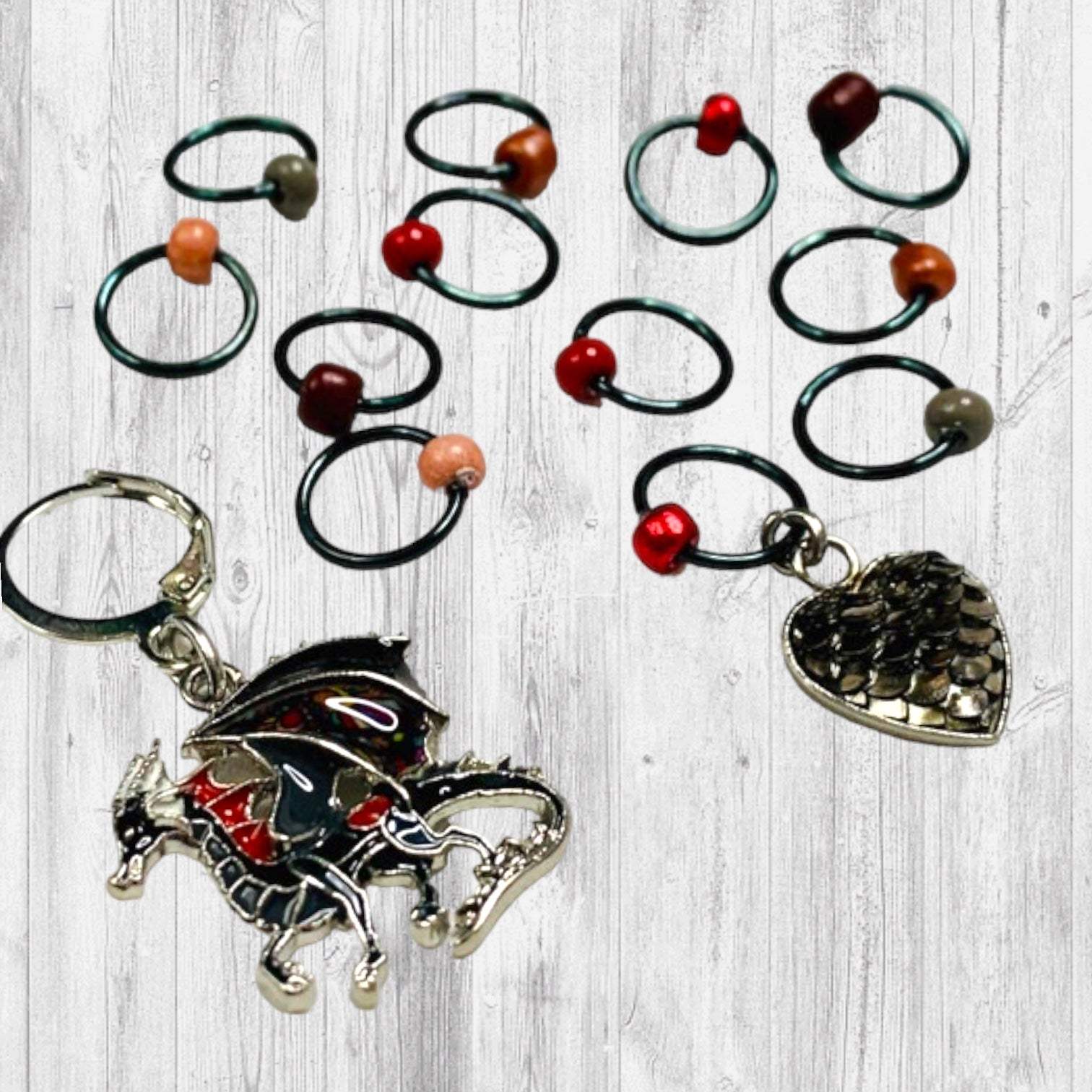 Fire Will Reign Progress and Stitch MarkersAdoreKnit“It has been said that dragon-fire could melt and consume the Rings of Power, but there is not now any dragon left on earth in which the old fire is hot enough; nor Reign Progress