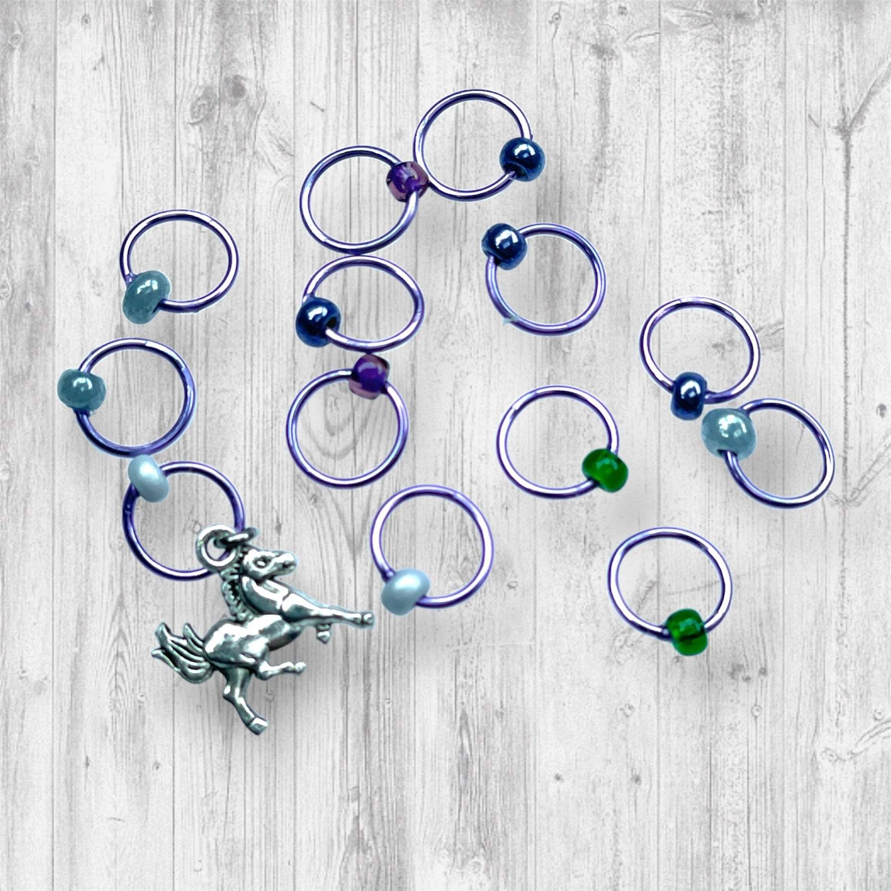 Evenstar inspired Progress and Stitch MarkersAdoreKnitEvenstar inspired Progress and Stitch Markers.   Inspired by the Evenstar worn by Arwen in The Lord of the Rings.  And also inspired by Arwen and Frodo's race on horEvenstar inspired Progress