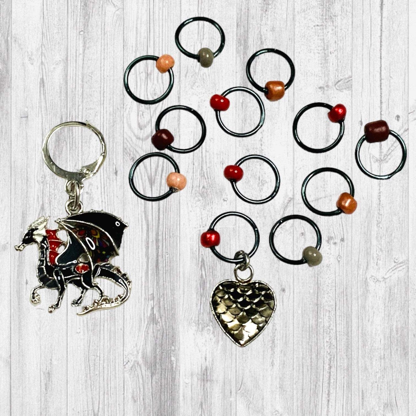 Fire Will Reign Progress and Stitch MarkersAdoreKnit“It has been said that dragon-fire could melt and consume the Rings of Power, but there is not now any dragon left on earth in which the old fire is hot enough; nor Reign Progress