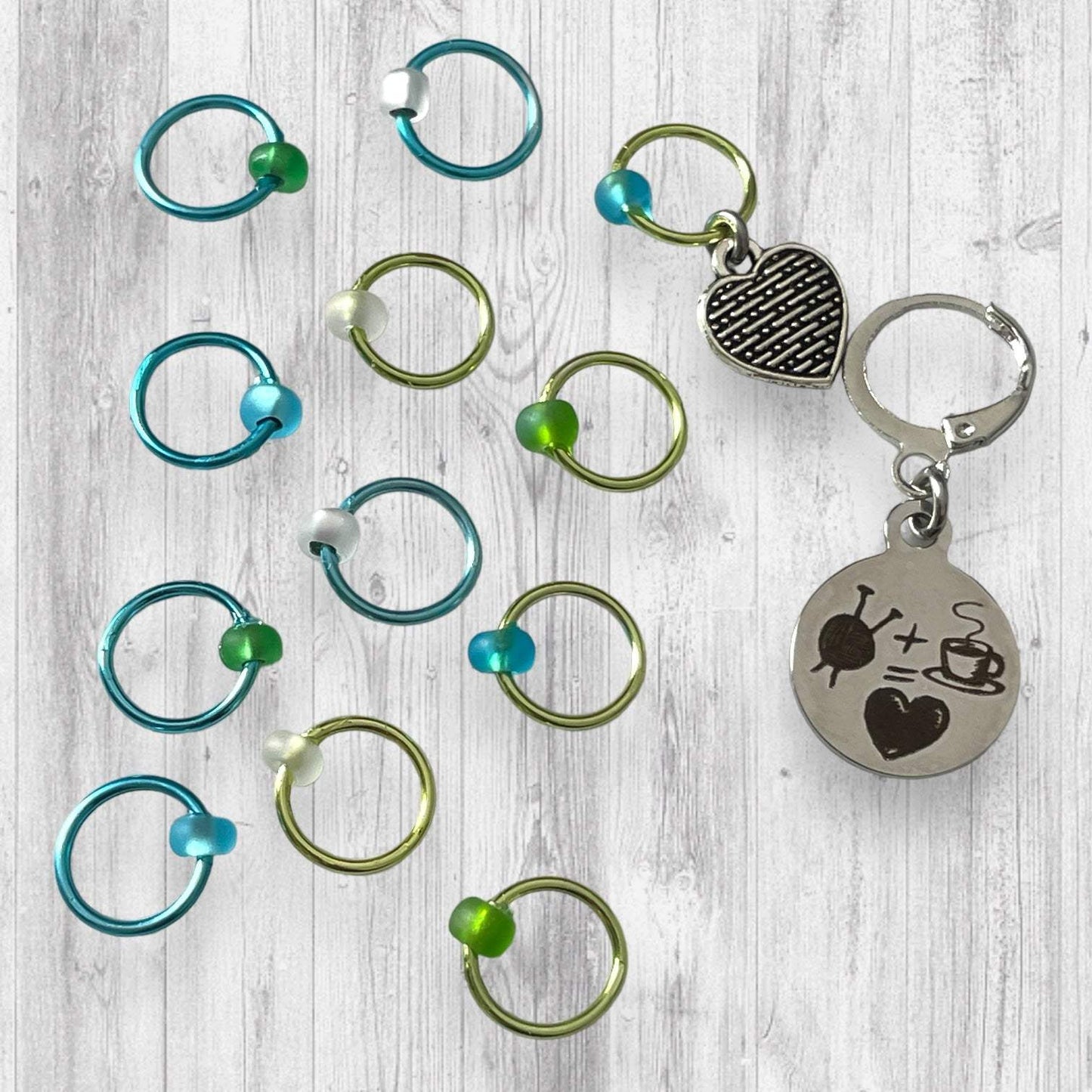 Love Some Knitting & Coffee Progress and Stitch MarkersAdoreKnitLove Some Knitting & Coffee Progress Marker and Stitch Markers.  Who doesn't love a nice warm beverage, their knitting and a new episode of your favorite show?  Knitting & Coffee Progress