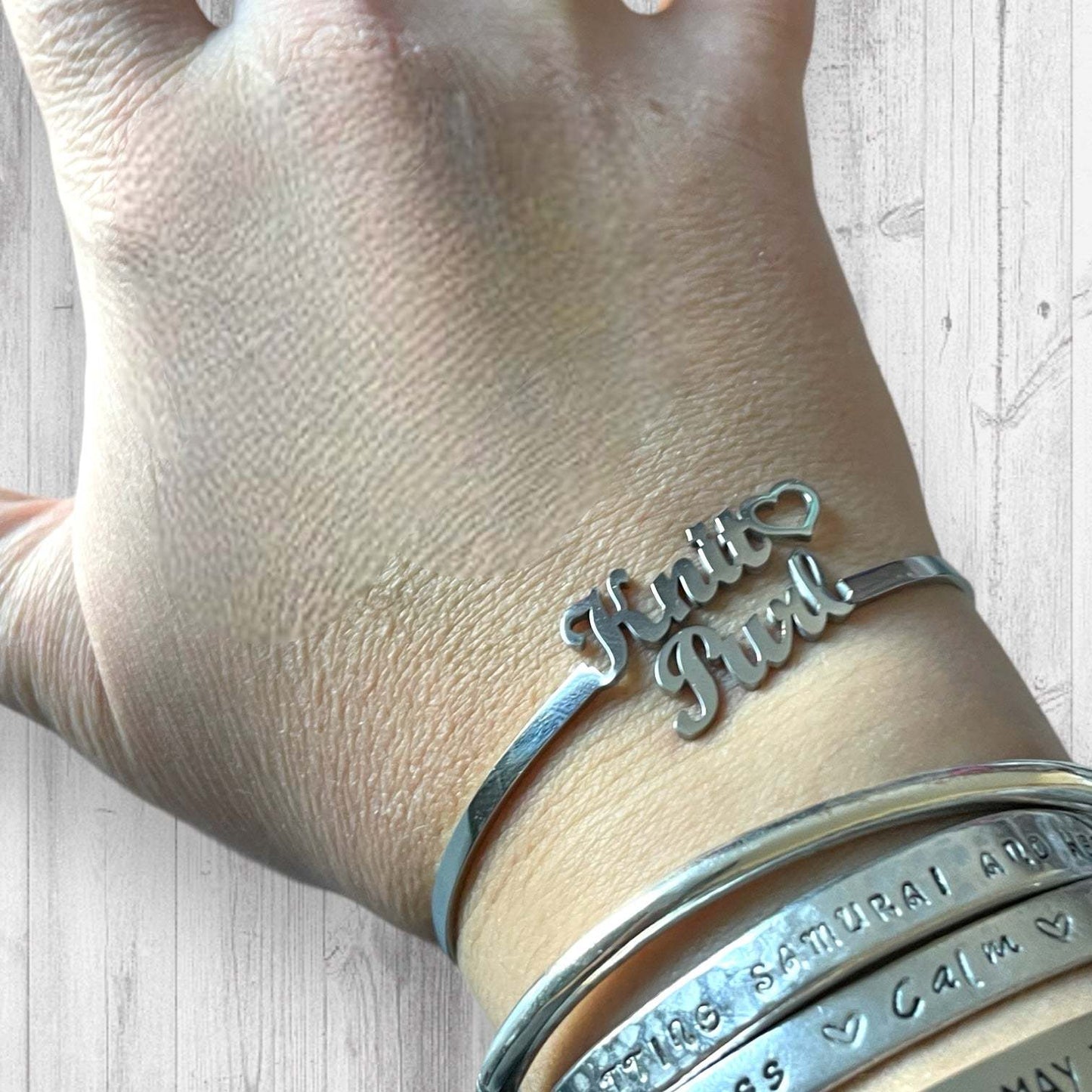 Knit🖤 Purl BraceletAdoreKnitThe Knit 🖤 Purl Bracelet has arrived!  Designed by Steph we've been anxious to share this beauty with you all.  This stainless steel bangle is the perfect way to shKnit🖤 Purl Bracelet