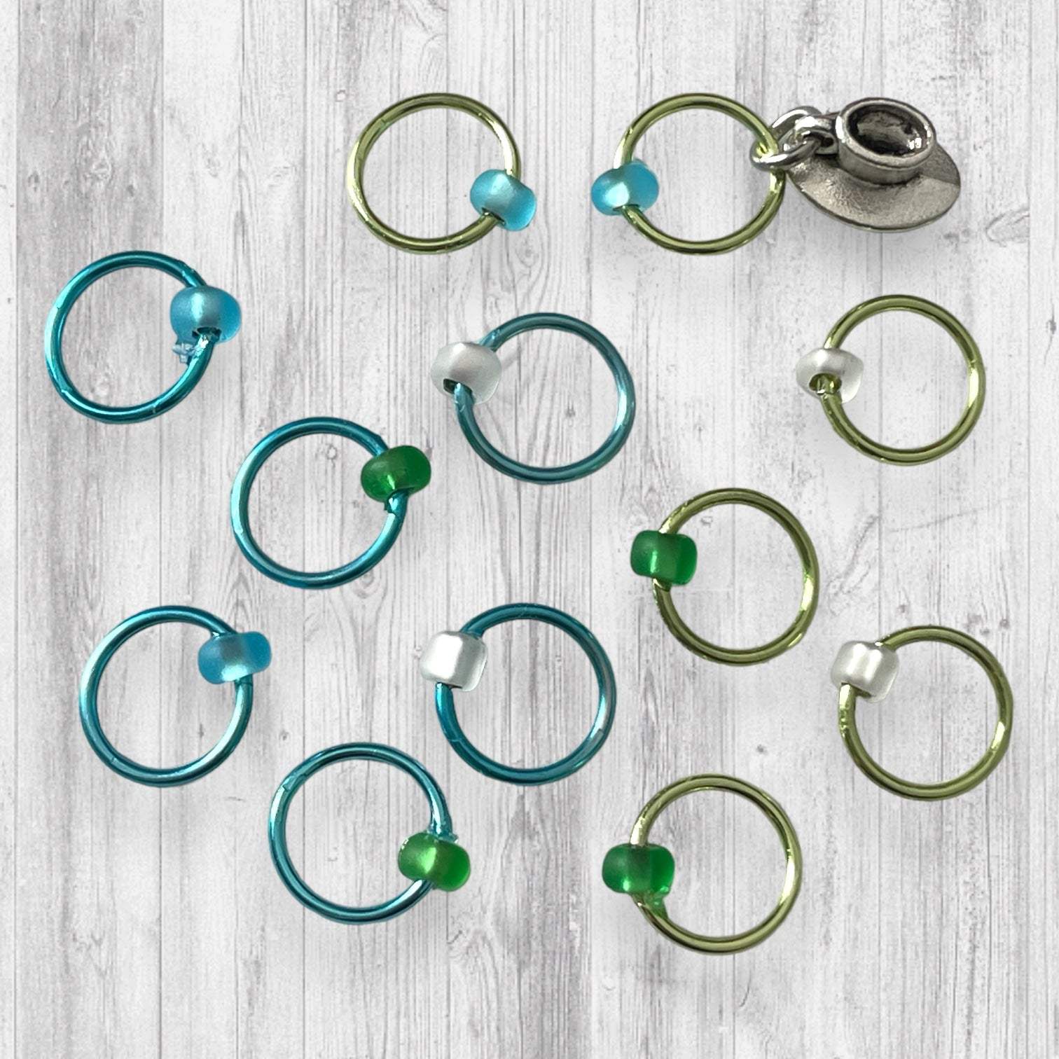 Love Some Knitting & Coffee Progress and Stitch MarkersAdoreKnitLove Some Knitting & Coffee Progress Marker and Stitch Markers.  Who doesn't love a nice warm beverage, their knitting and a new episode of your favorite show?  Knitting & Coffee Progress