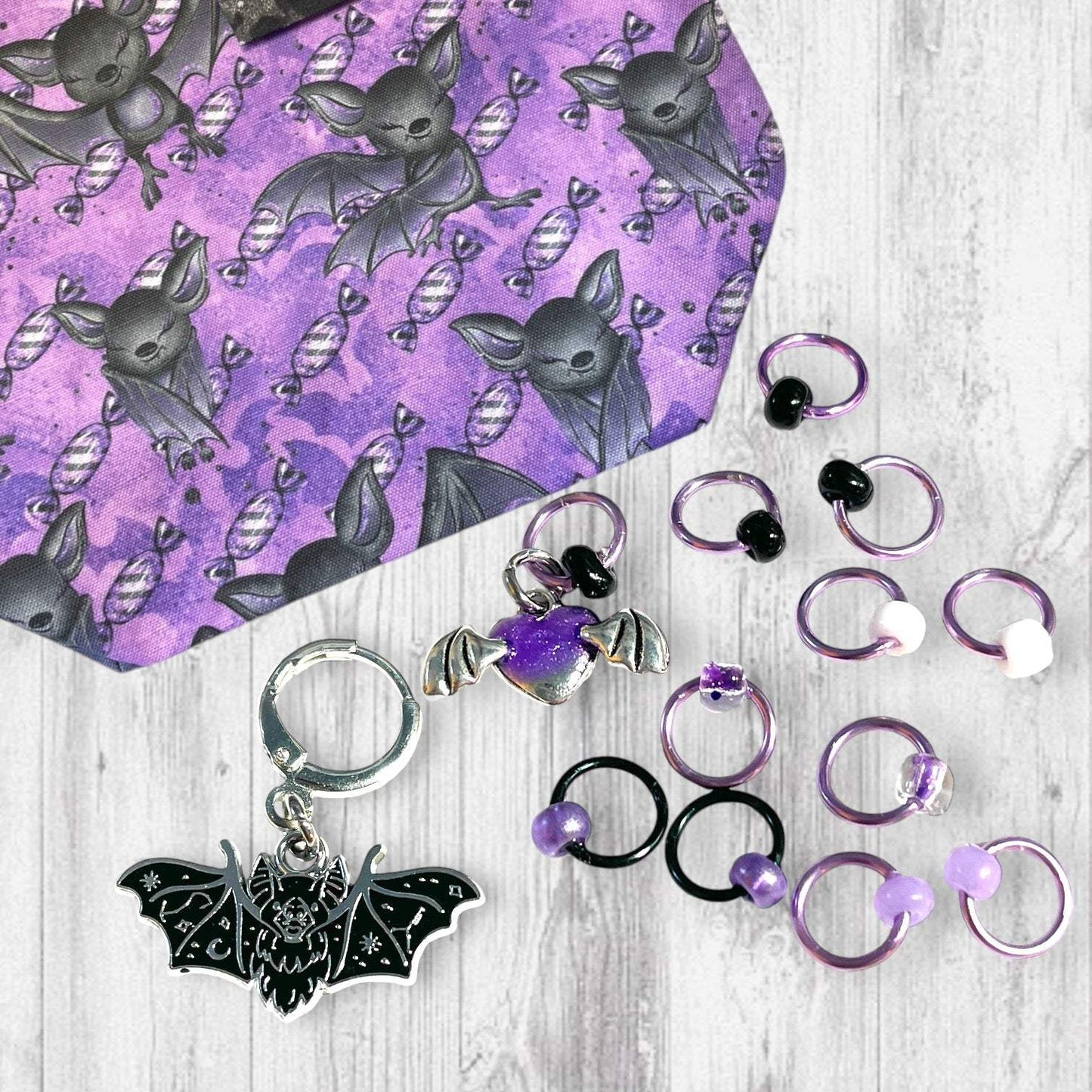 Playful Purple Bats Pass Piles of Peppermint Candy Progress and Stitch Markers