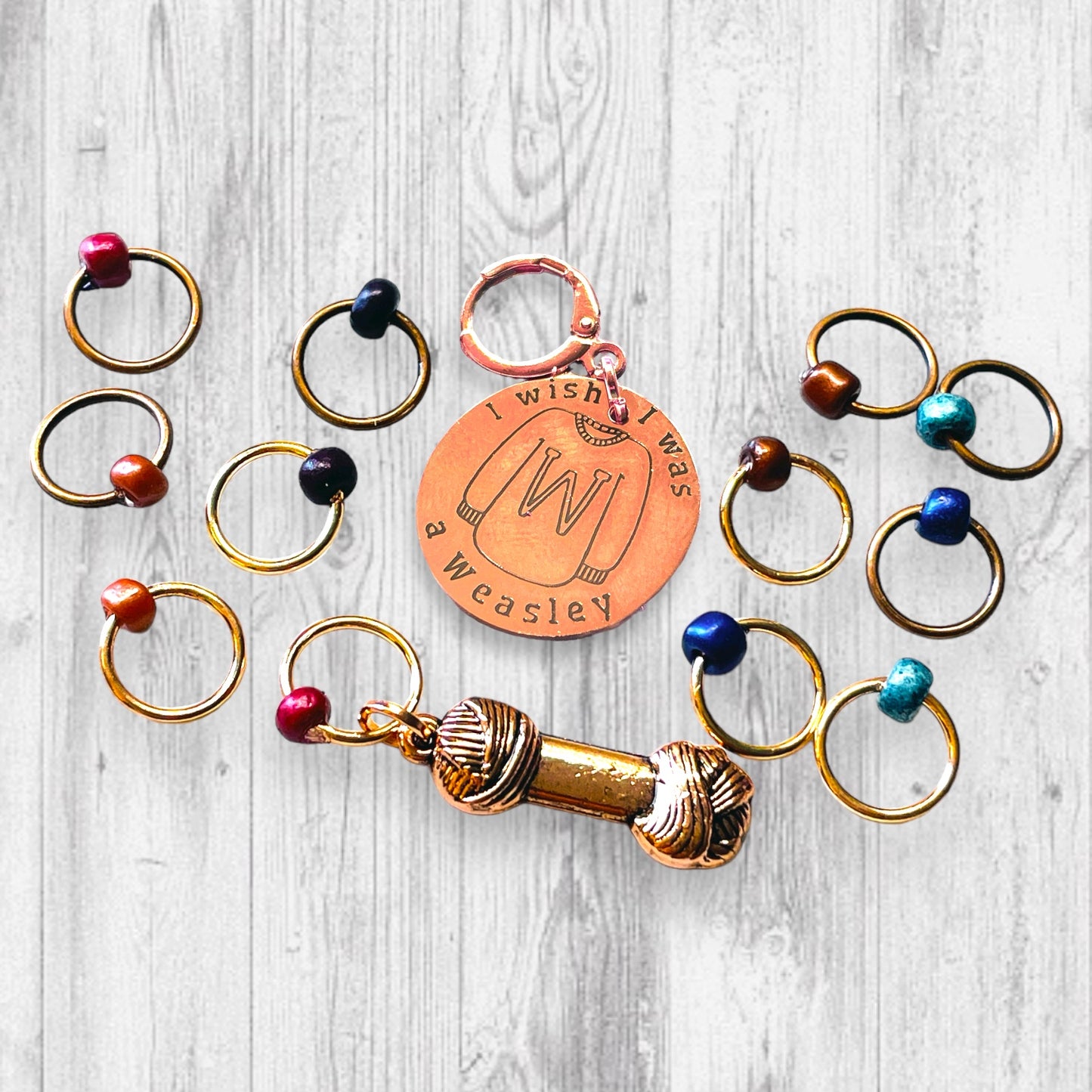 I Wish I Was A Weasley Progress and Stitch Marker SetAdoreKnitI Wish I Was A Weasley Progress and Stitch Markers.  Rose Gold and Copper stitch markers are reminiscent of the famous family's most distinguishing features.  ImaginStitch Marker Set