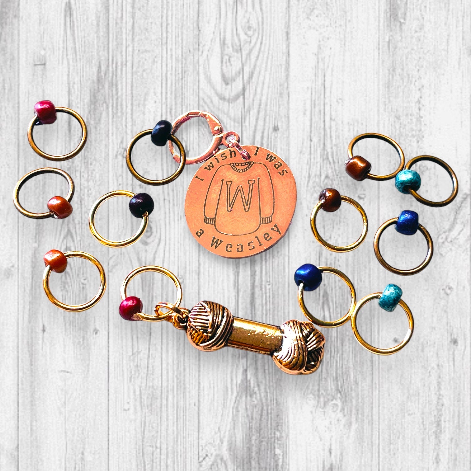 I Wish I Was A Weasley Progress and Stitch Marker SetAdoreKnitI Wish I Was A Weasley Progress and Stitch Markers.  Rose Gold and Copper stitch markers are reminiscent of the famous family's most distinguishing features.  ImaginStitch Marker Set