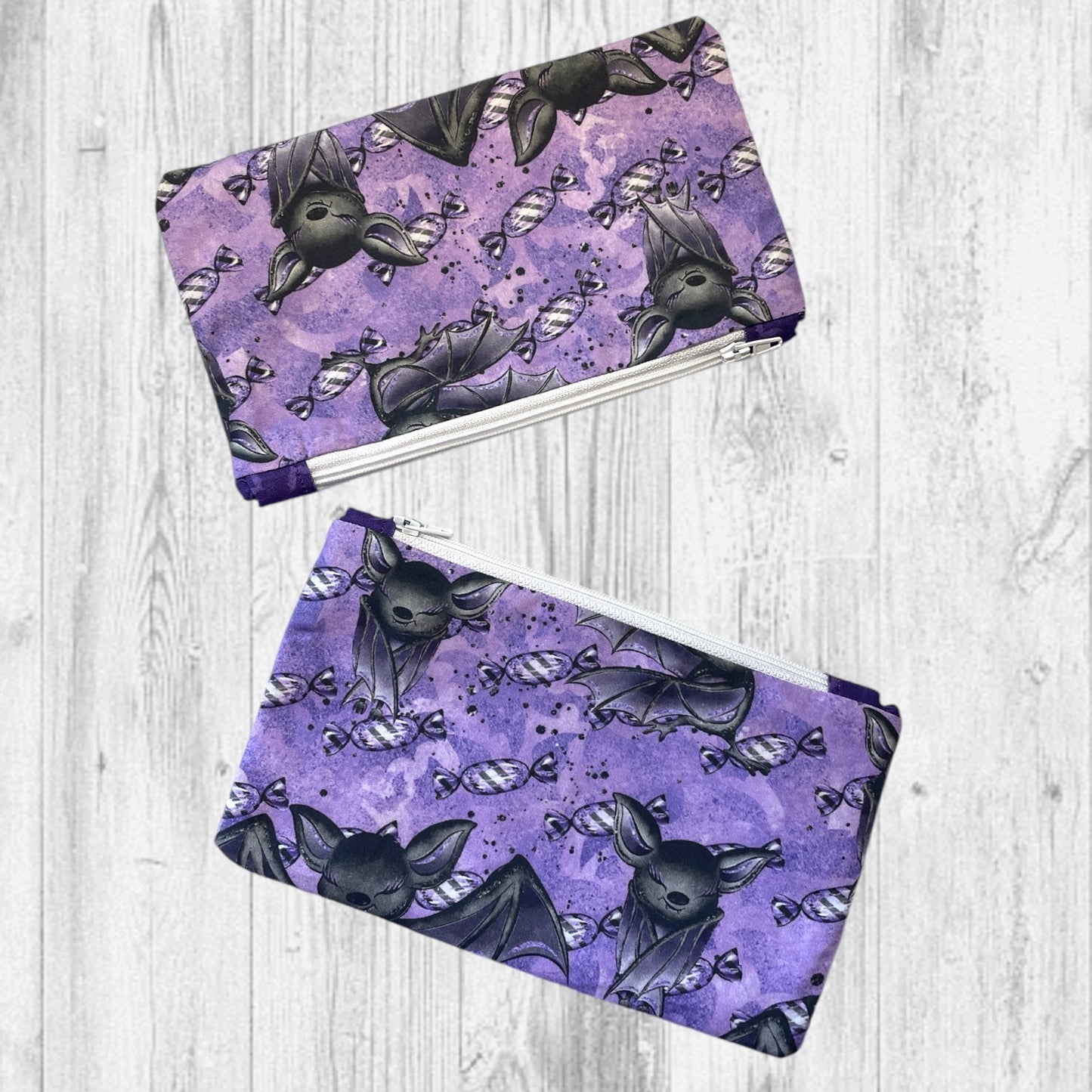 Playful Purple Bats Pass Piles of Peppermint Candy Notion's Pouch