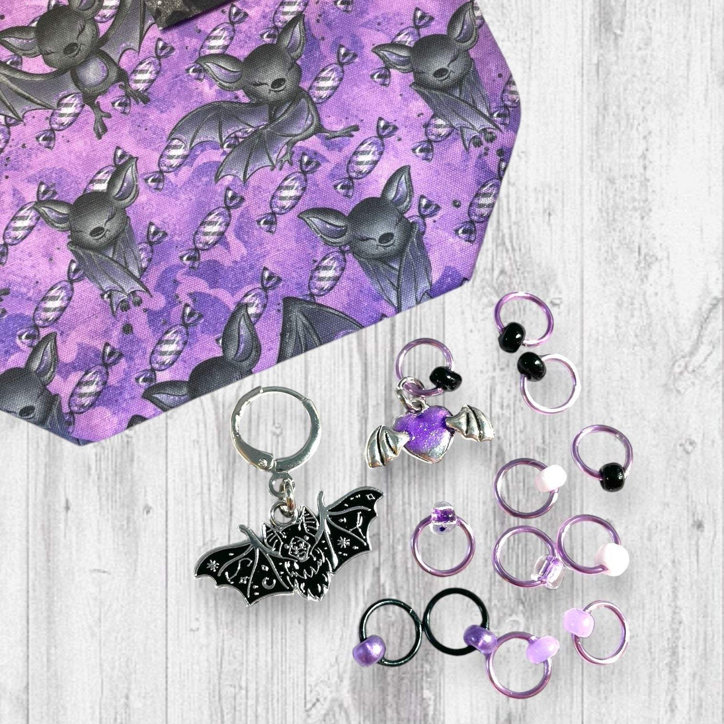 Playful Purple Bats Pass Piles of Peppermint Candy Progress and Stitch Markers