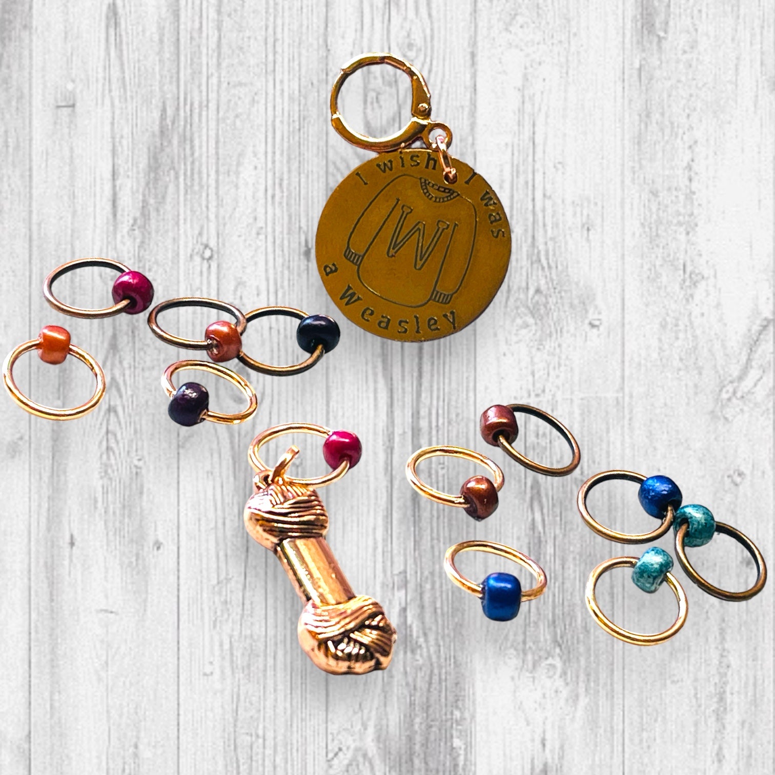 I Wish I Was A Weasley Progress and Stitch Marker SetAdoreKnitI Wish I Was A Weasley Progress and Stitch Markers.  Rose Gold and Copper stitch markers are reminiscent of the famous family's most distinguishing features.  ImaginStitch Marker Set