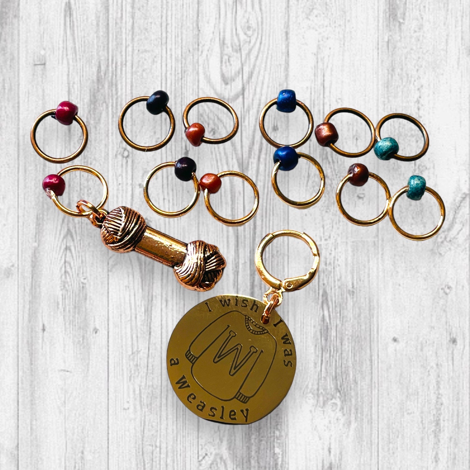 I Wish I Was A Weasley Progress and Stitch Marker SetAdoreKnitI Wish I Was A Weasley Progress and Stitch Markers.  Rose Gold and Copper stitch markers are reminiscent of the famous family's most distinguishing features.  ImaginStitch Marker Set