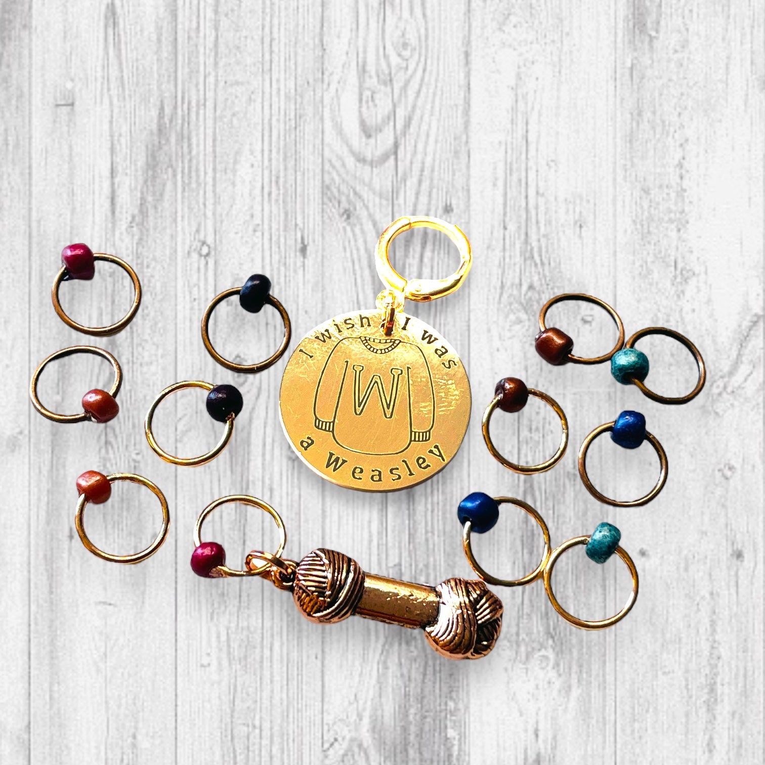 I Wish I Was A Weasley Progress and Stitch Marker SetAdoreKnitI Wish I Was A Weasley Progress and Stitch Markers.  Rose Gold and Copper stitch markers are reminiscent of the famous family's most distinguishing features.  ImaginStitch Marker Set