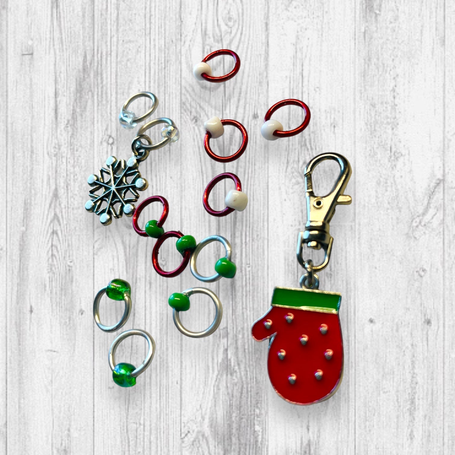 Red Mitten & Snowflake Progress and Stitch MarkersAdoreKnitRed Mitten &amp; Snowflake Progress and Stitch Marker Set. These stitch markers are great for a knitter or crocheter. Include in a swap package, teacher gift, or a lRed Mitten & Snowflake Progress