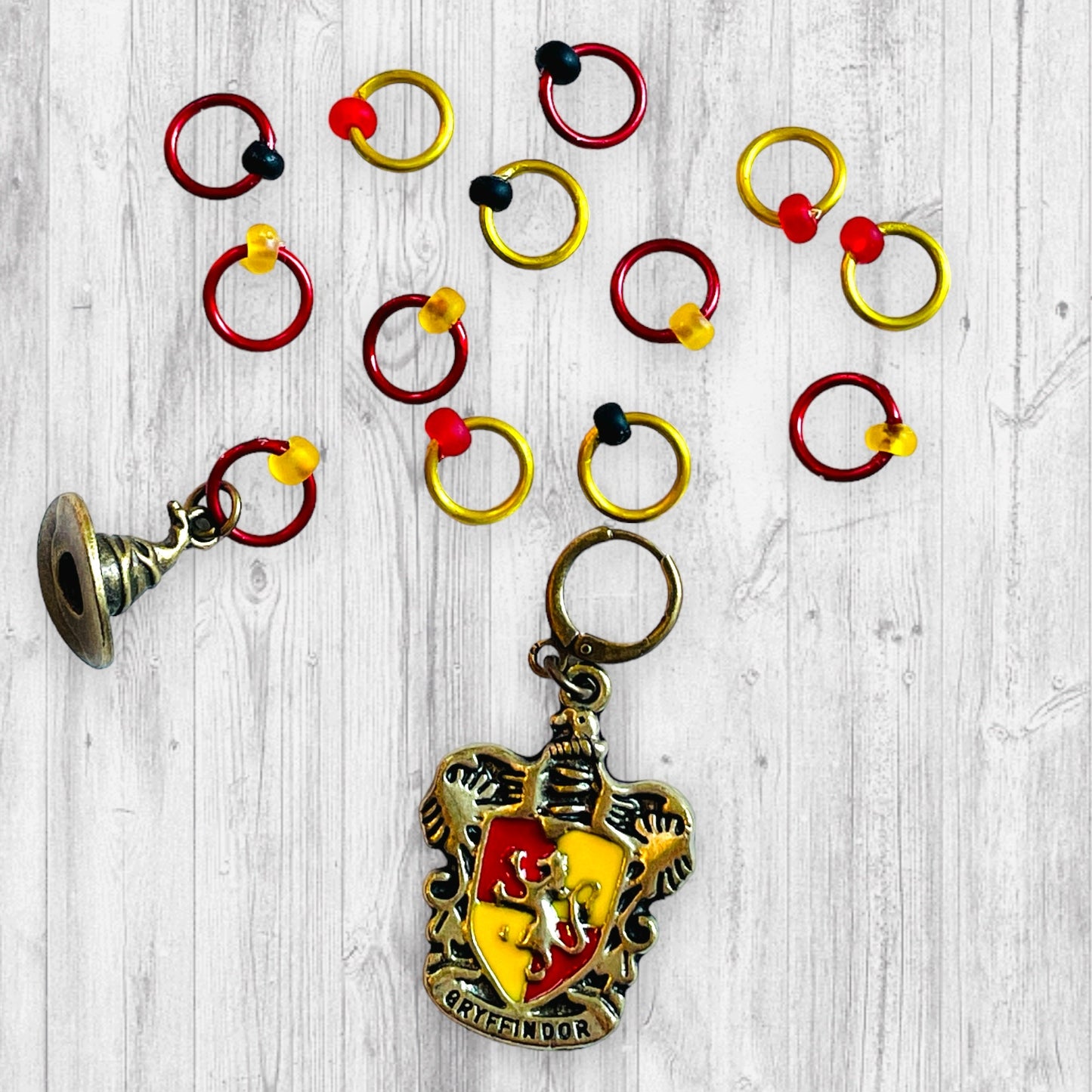 Sorted into Red and Gold Progress and Stitch Markers - AdoreKnit